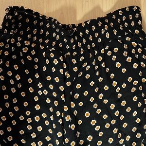 Long black pants that come from YTEICOSAMUSE